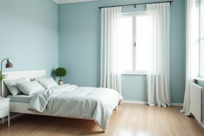 Chambre moderne et cosy avec murs pastel bleu et mobilier blanc